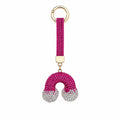 Regenbogenförmiger Schlüsselanhänger & Taschenaccessoire mit Strasssteinen – Rosa